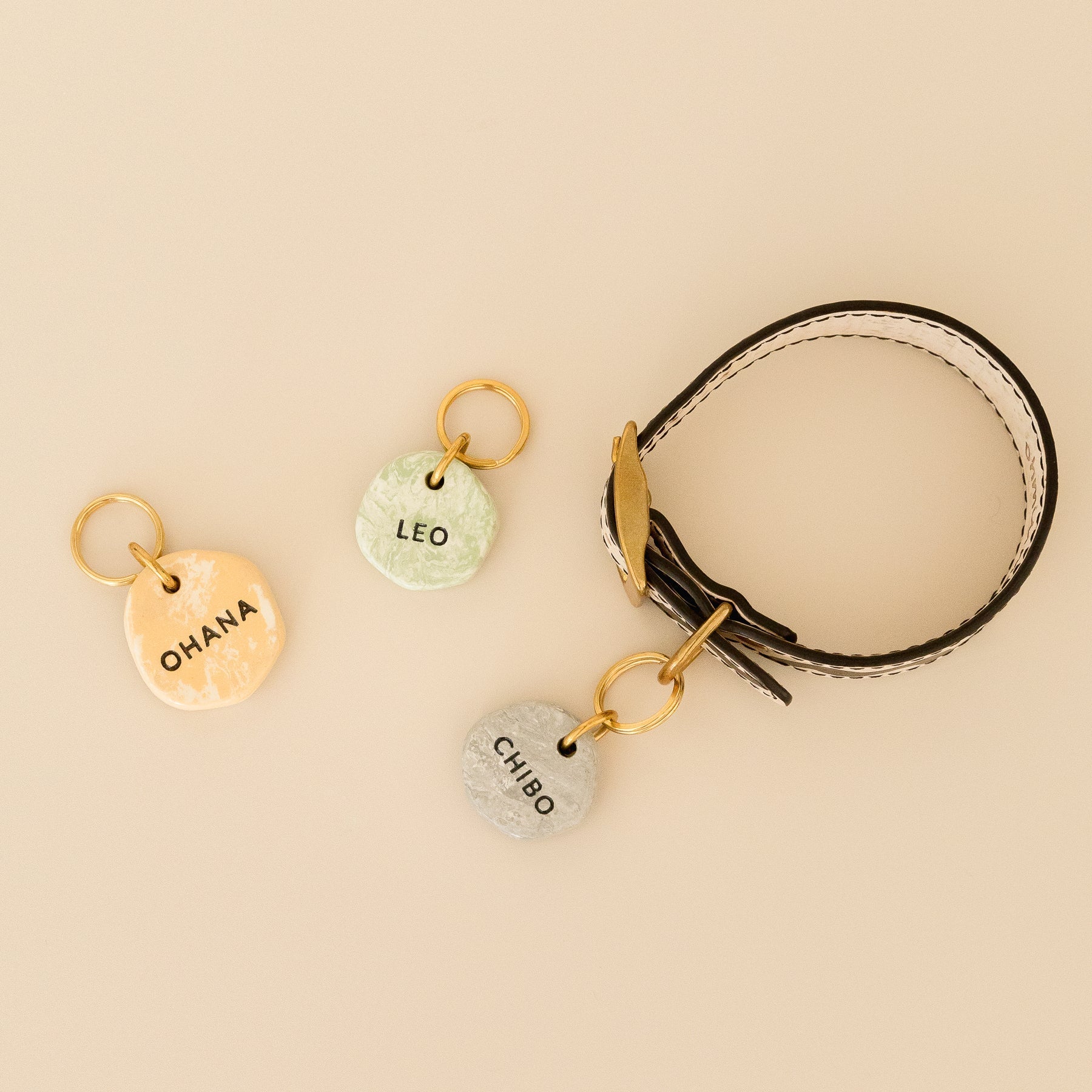 three custom dog tags in marble look with vegan cork leather dog collar