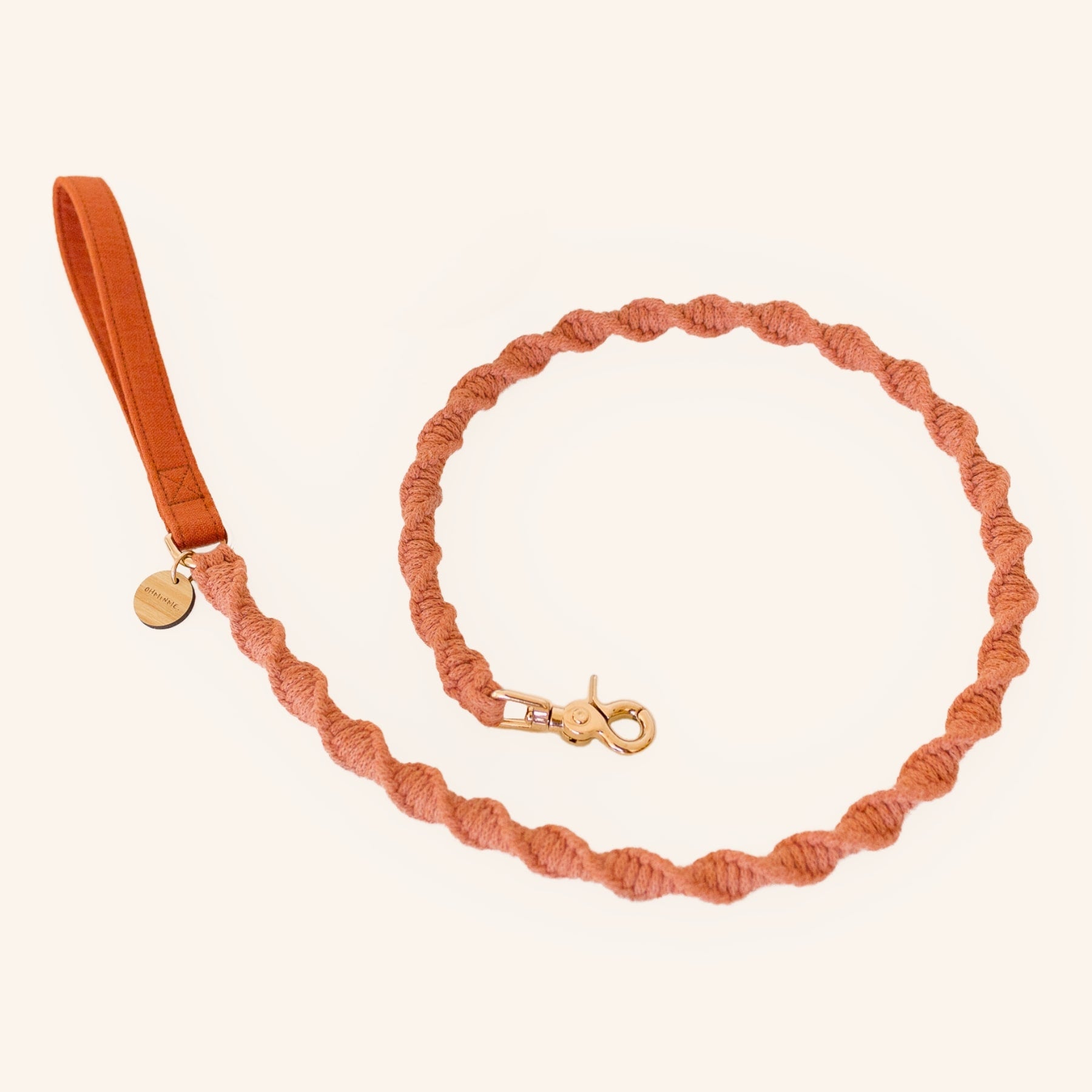 macrame dog leash in orange terracotta with brass details and bamboo tag