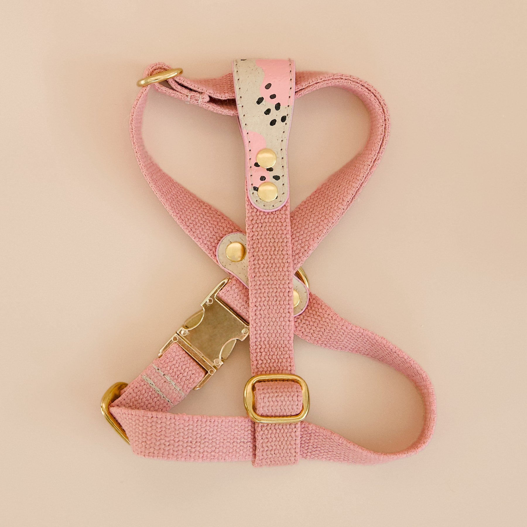 Pink vegan cork leather and organic hemp dog cross harness with brass hardware, hand-painted details, front view