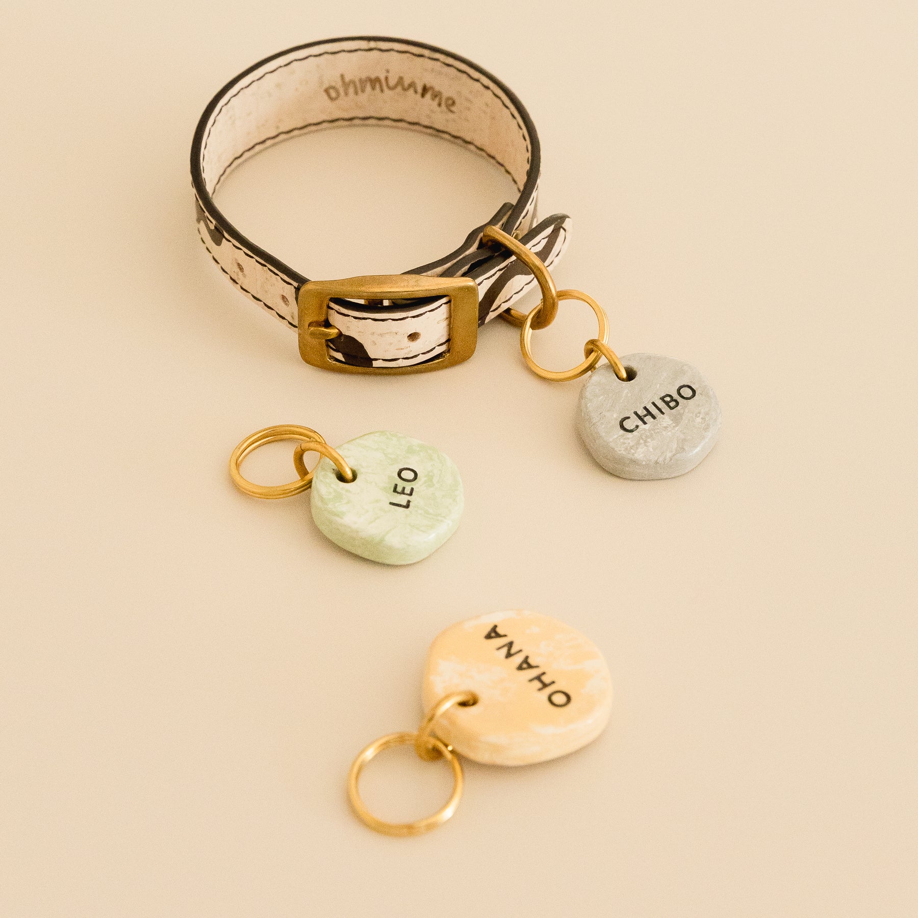 hand-painted cork leather dog collar with three personalized marble-look ID tags featuring brass details