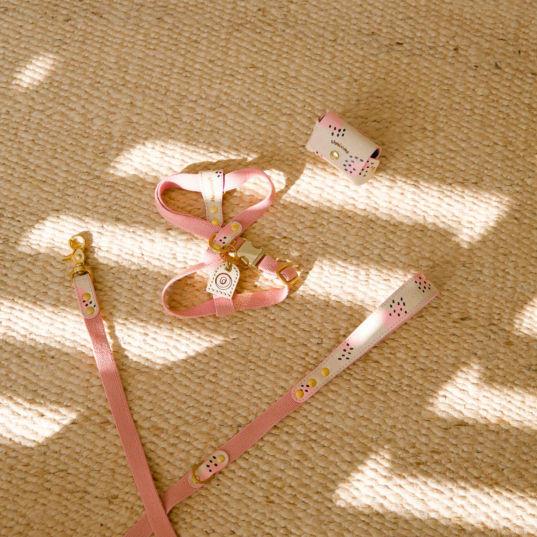 Pink dog harness with ID name tag, poop bag holder, and leather leash in cream beige cork and hemp with pink painted details