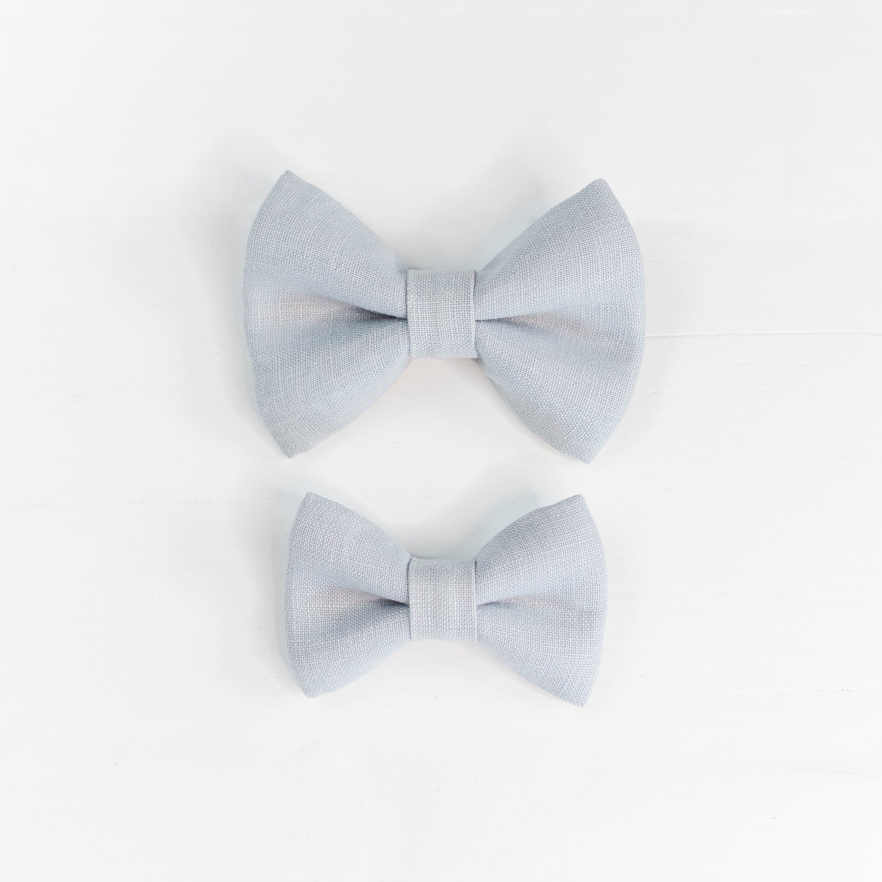 Two dog bow ties in blue linen.