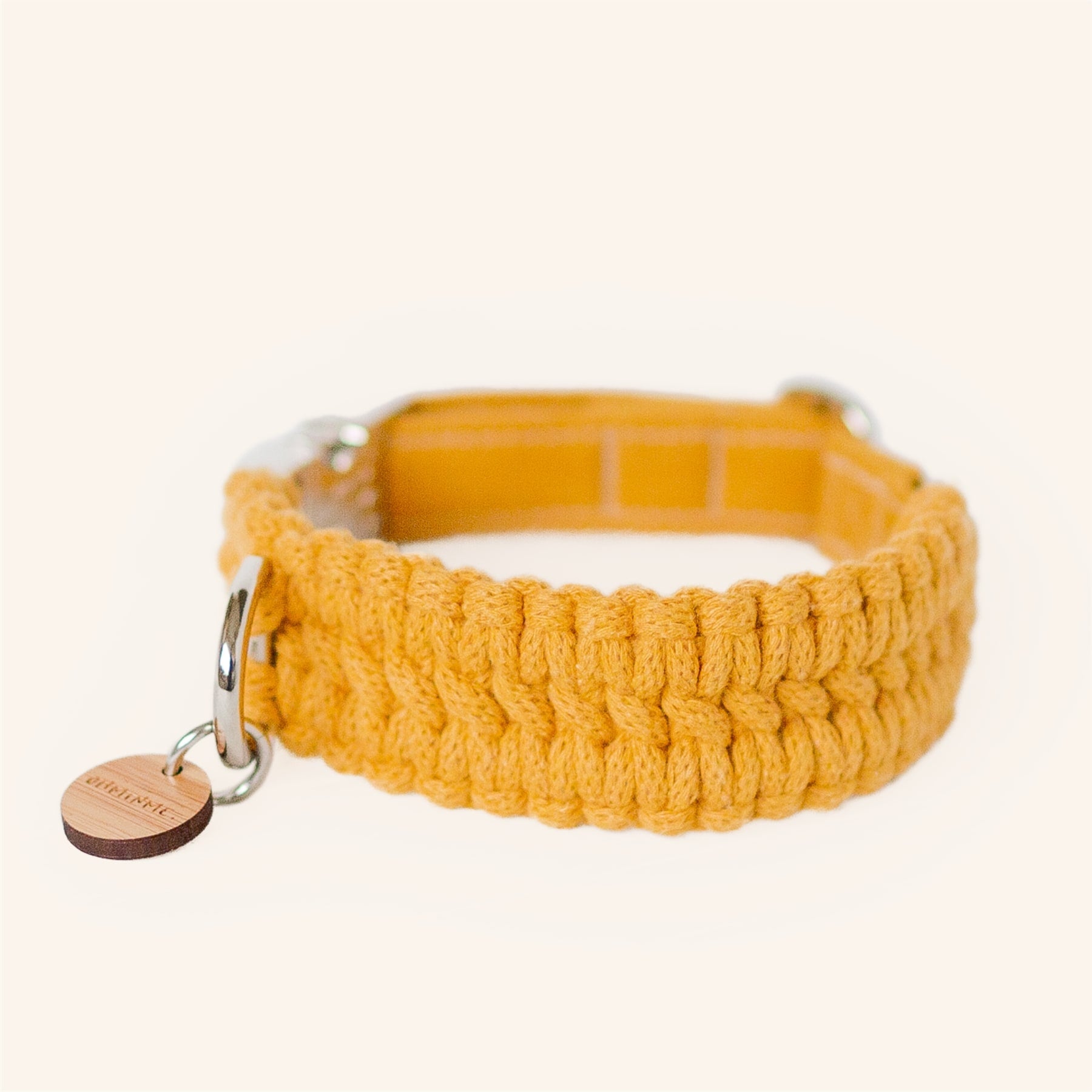 macrame dog collar in mustard yellow with silver hardware and bamboo tag