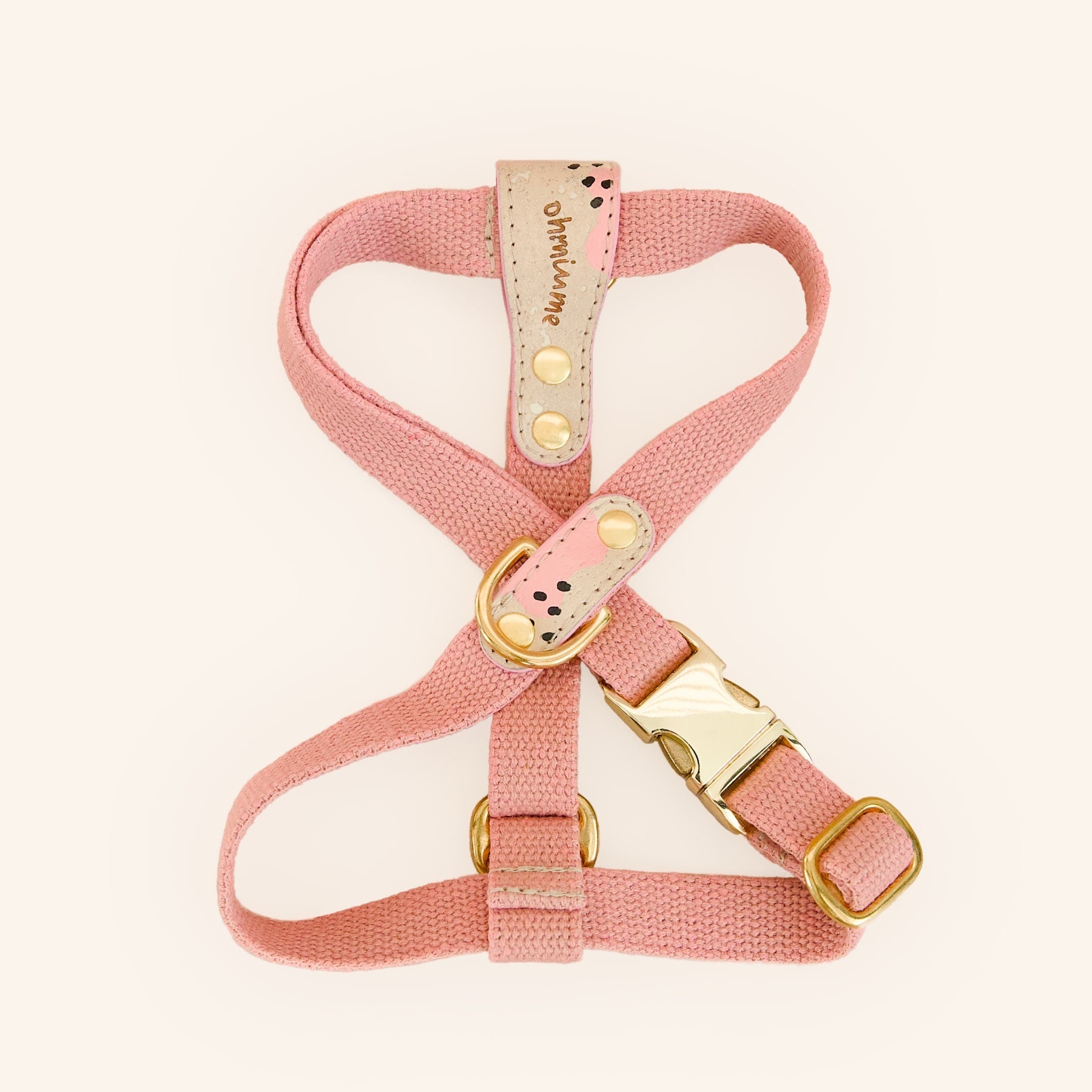 Pink dog harness in vegan cork leather and hemp with brass hardware, top view.