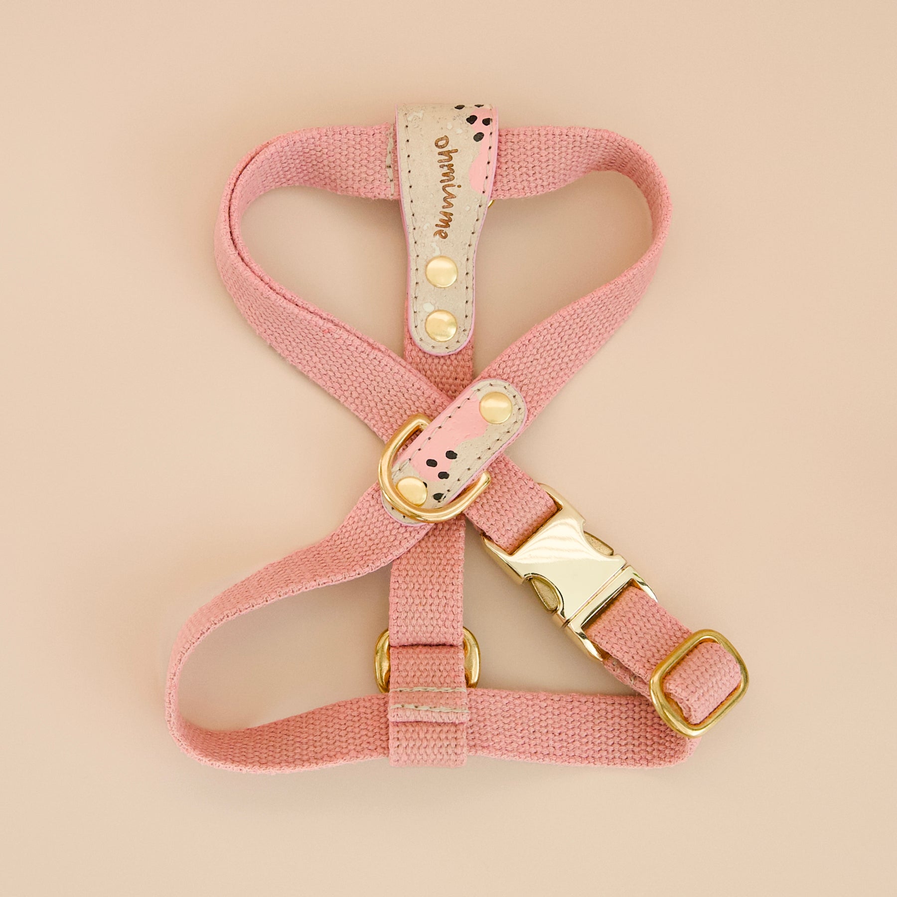 Pink vegan cork leather and organic hemp dog cross harness with brass hardware, top view