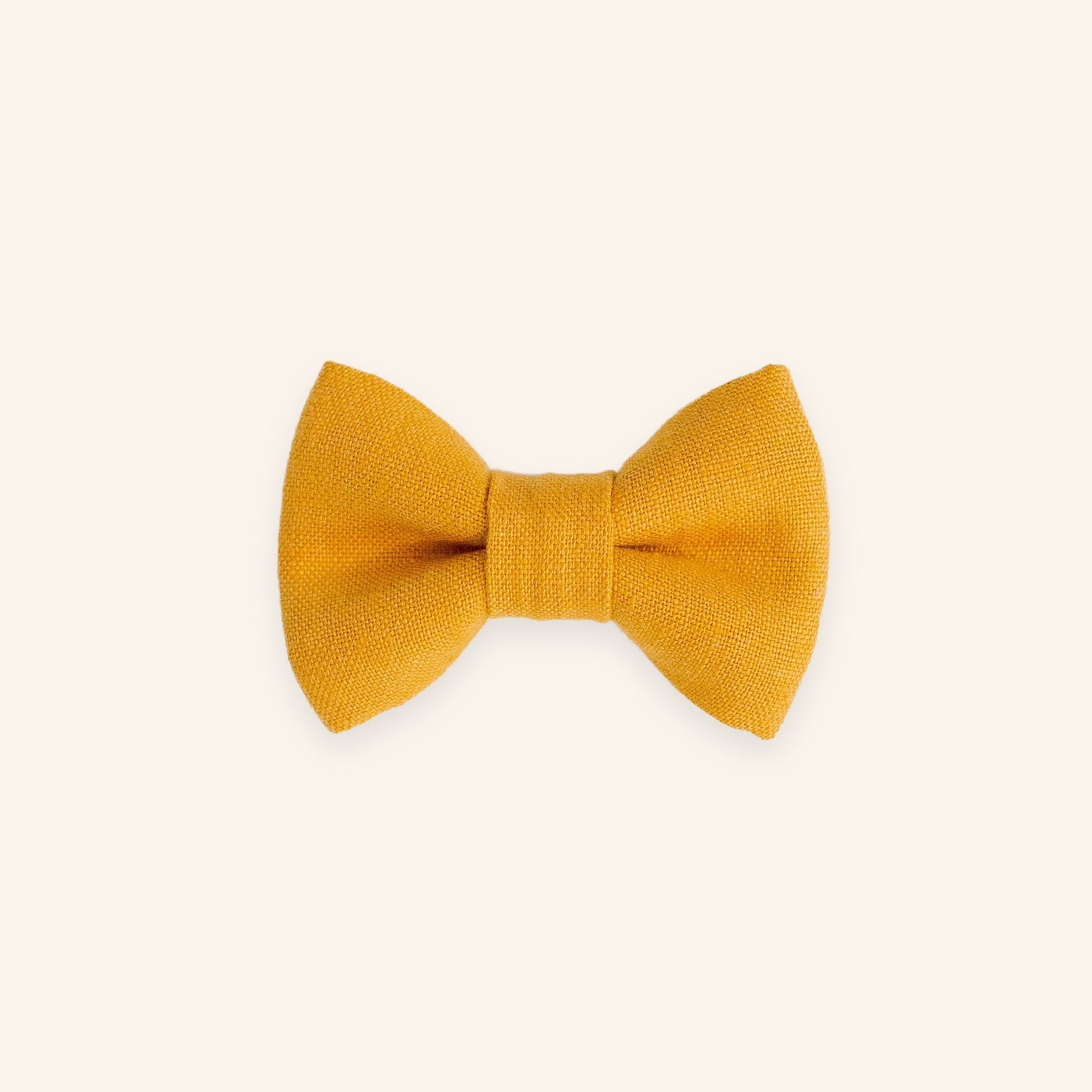Mustard yellow dog bow tie in linen, front view.