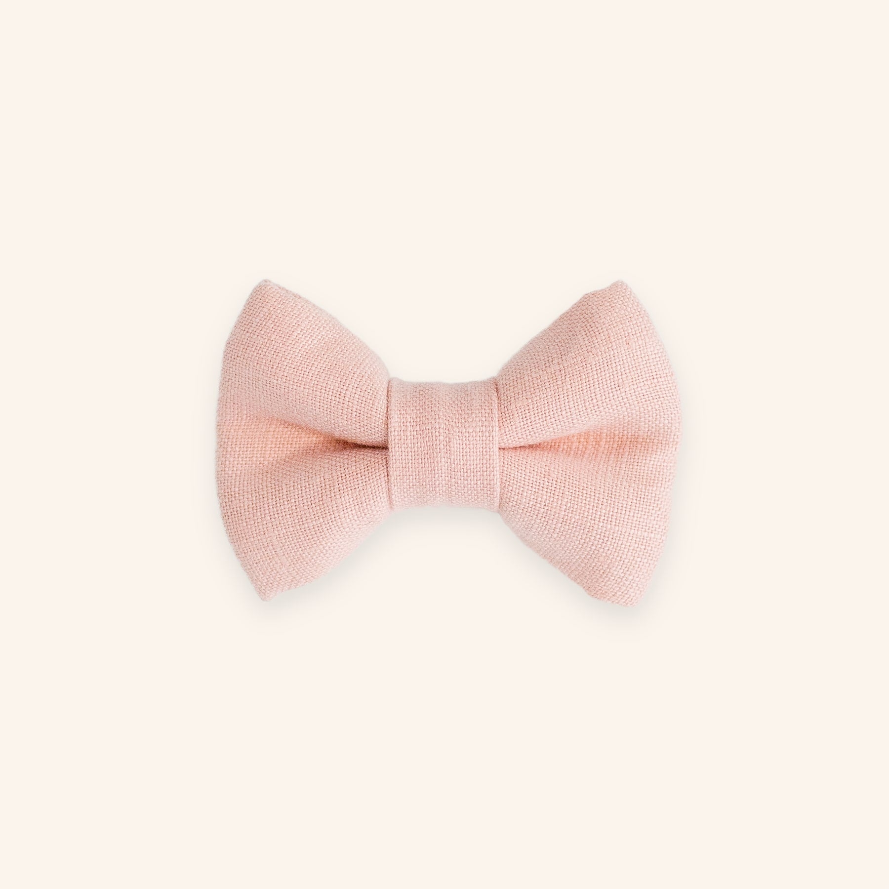 Pink dog bow tie in linen, front view.