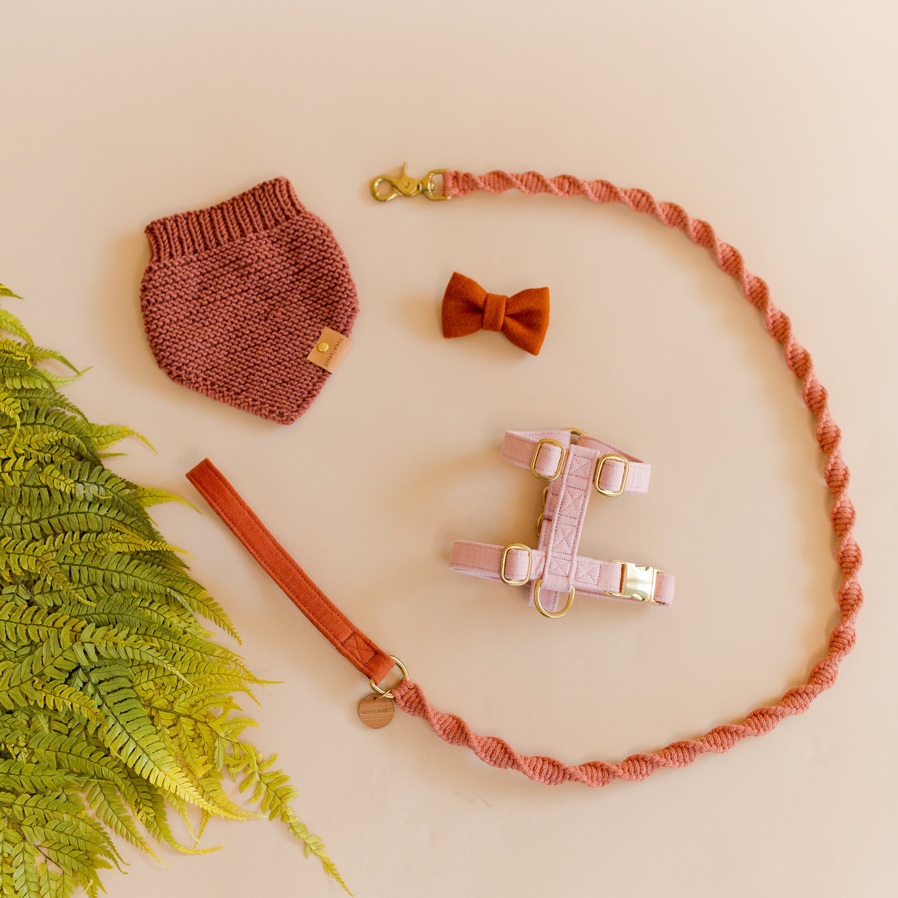 wool dog bandana and wool dog bow tie with a matching macrame dog leash, paired with a pink harness